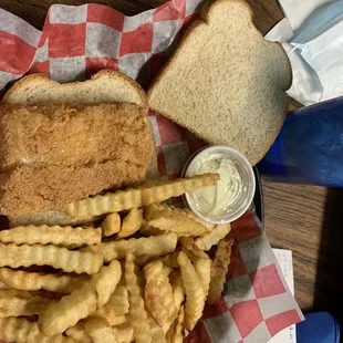 Fish sandwich, wheat bread &amp; french fries.
