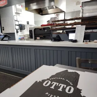 a pizza sitting on a table in a restaurant