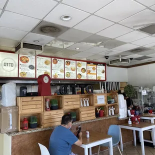 a man sitting at a table in a restaurant