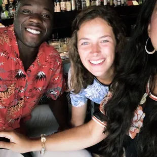 three people smiling