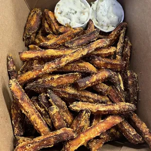 A basket of light and crispy sweet potato fries. The best! Enjoy with a side of garlic herb aioli.