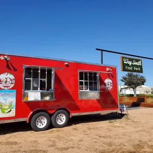Red trailer right next to kitchen