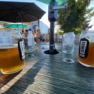 two glasses of beer on a table