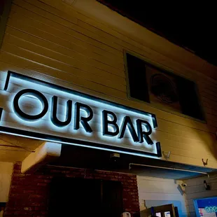 a neon sign on the outside of a building