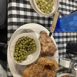 Grilled tenderloin, fried pork chop, peas and Lima beansq
