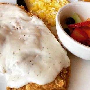 Chicken fried chicken!! Delish!!! With a side of fresh fruit, scrambled eggs and a stack of pancakes