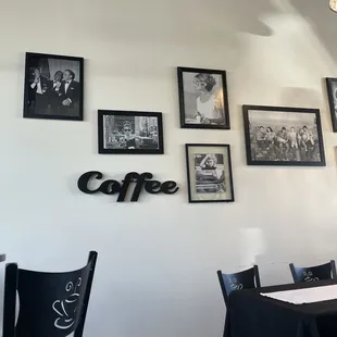 a wall of black and white photos