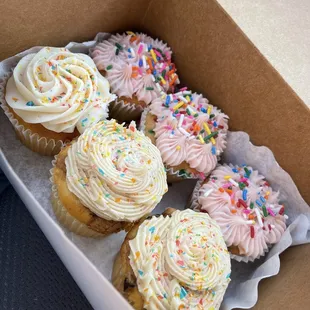 Birthday cake cupcakes, and one vanilla and two cookie dough