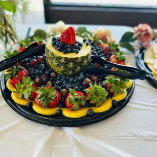 a platter of fruit and cheese