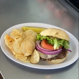 a hamburger and chips on a plate