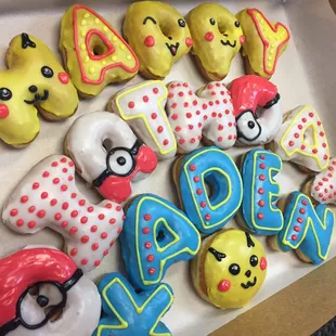 a box of decorated donuts