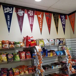 a variety of pennants hanging on the wall