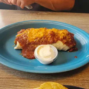 Breakfast burrito w eggs, peppers and onions, potatoes,and bacon!