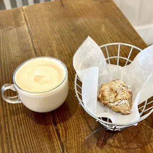 a cup of coffee and a pastry