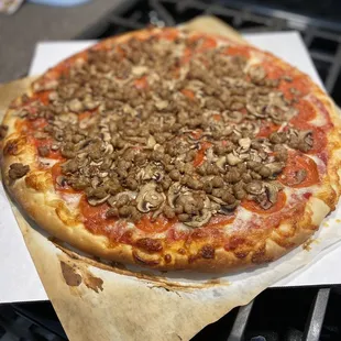 a pizza with mushrooms on it