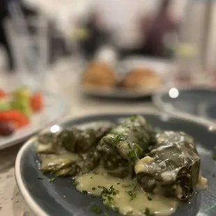 a plate of stuffed grape leaves
