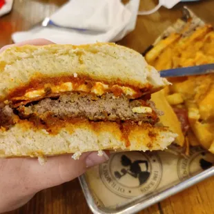 Pizza burger with cheese fries.