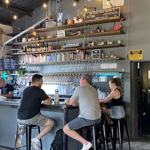 two people sitting at the bar
