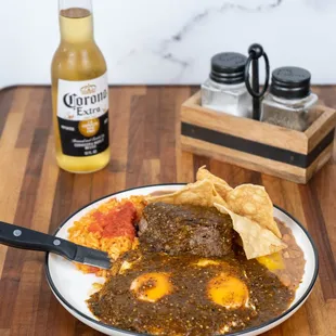 Filet &amp; Huevos Rancheros: grass fed filet mignon 2 over easy eggs w/choice of salsa, w/ Spanish rice and  pinto beans and tortilla chips.