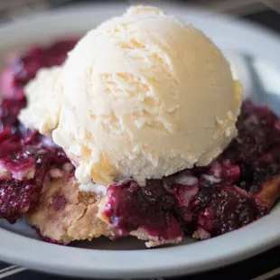 Blackberry Cobbler served warm with vanilla ice cream