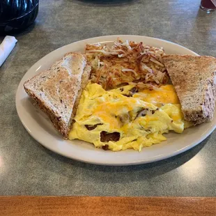 Scrambled eggs with bacon, cheese &amp; wheat toast