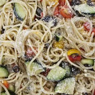 a plate of pasta with vegetables