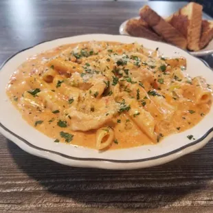 a plate of pasta and bread