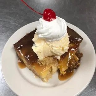 a piece of cake with a cherry on top