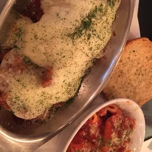 Chicken parm boat deluxe over garlic toast with pasta