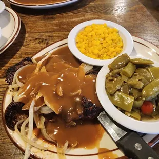 Liver with onion and gravy, with green beans and corn.