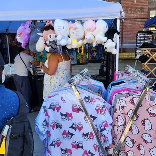 a woman selling hello kitty merchandise