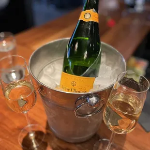 a bottle of champagne in an ice bucket
