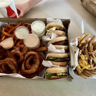 Hamburgers, two orders of onion rings, sweet potato fries, and an order of Cagney fries.