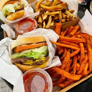 a tray of fries and a burger