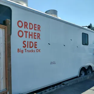 Left hand side of the &quot;building&quot; where you pay and get your food.