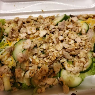 a salad in a styrofoam container