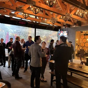 a large group of people standing in a room