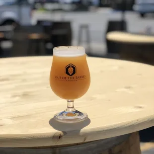 a glass of beer on a table