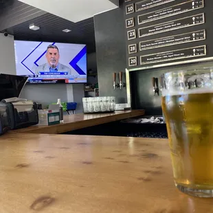 Open airflow indoor bar with a several TVs.