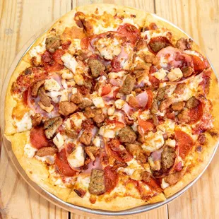 a pizza with meat and cheese