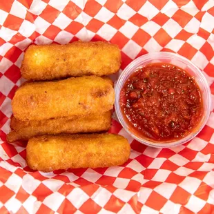 a basket of deep fried bread sticks