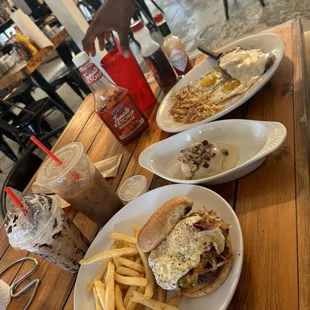 Brunch burger with fries and homemade ranch and the country fried chicken plate . Drinks- cookies and cream latte  Salted caramel cold brew