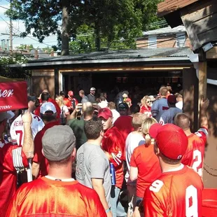ows a large group of football fans