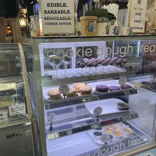 a display case filled with donuts