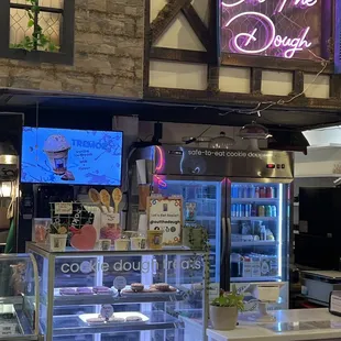 a bakery with a neon sign