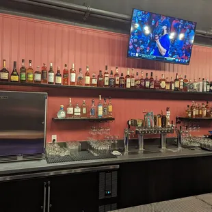 Extensive whiskey collection and Giants, 49ers, Warriors on the big screen.