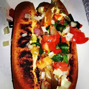 a hot dog with toppings