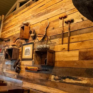 a wooden wall with various items on it