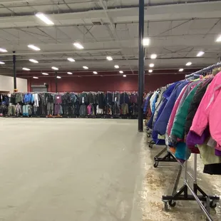 Behind these racks are more and more racks. All waiting to hit this floor after it's finish has dried.