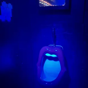 a toilet in a dark room